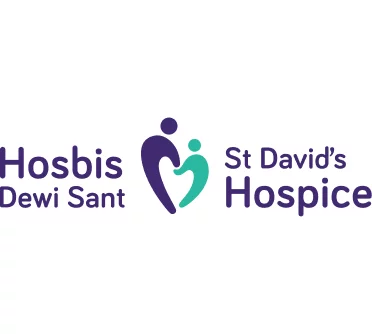 Hosbis Dewi Sant — St David's Hospice logo showing two stylised figures forming a heart in purple and teal
